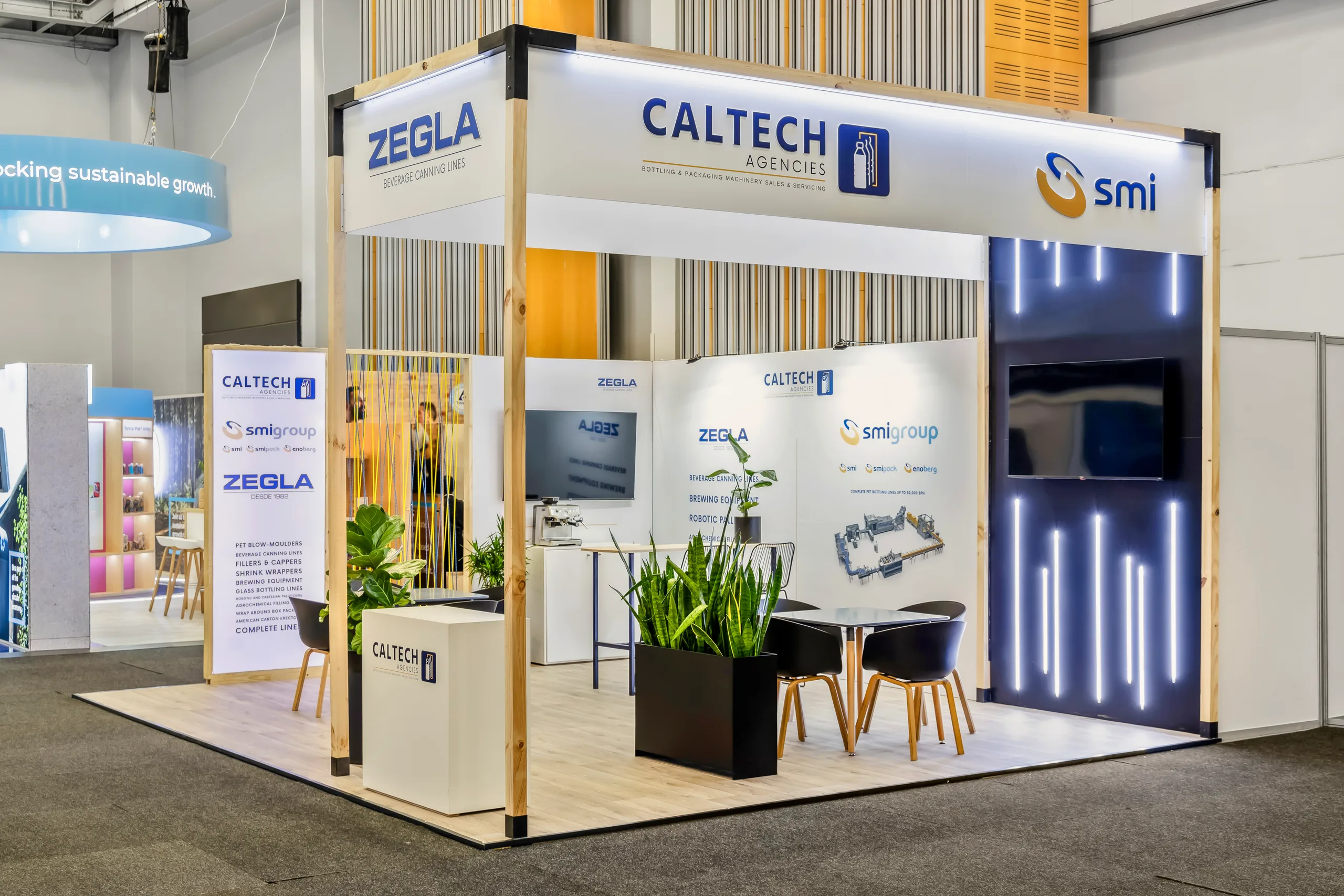 CalTech modular exhibition stand with timber-framed walls, planters and backlit panels